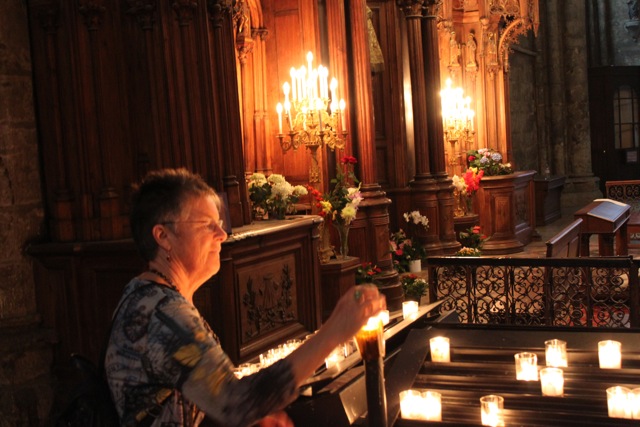 lighting a candle, Chartres cathedral 